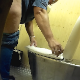 A fat, Eastern-European woman takes a shit while sitting on a public steel toilet. Loud noises in the background prevent us from hearing any decent pooping sounds. Presented in 720P HD. About 2.5 minutes.